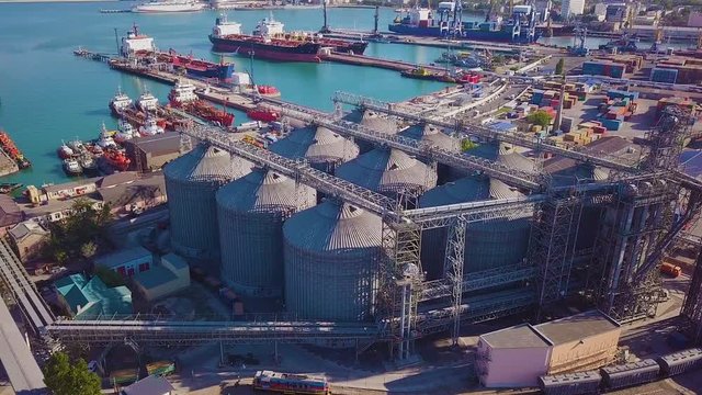 View from Above of the Grain Terminal in the Commercial Sea Port.In the Background you can see the Container Yard and Ships under Loading