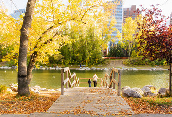 Woman and young boy admiring the view at Prince's Island Park in Autumn