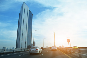 Car driving on highway  road against blue sky copy spec