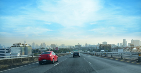 Car driving on highway  road against blue sky copy spec