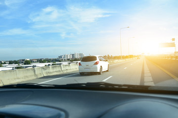 Car driving on highway  road against blue sky copy spec