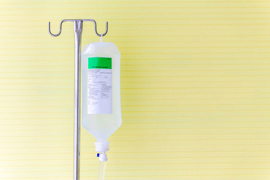 Saline Solution Fluid Iv Bag In Emergency Room At Hospital.