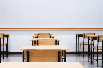 Empty School classroom with desks chair wood, greenboard and whiteboard in high school Thailand,...