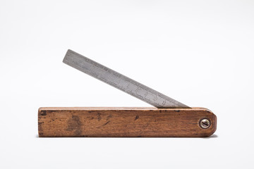 An old carpentry ruler on white paper