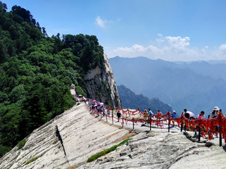 Chinese tourists on the West peak of sacred Huashan mountain, Shaanxi province, China