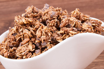 Oat flakes or granola with chocolate containing iron and fiber, healthy snack concept