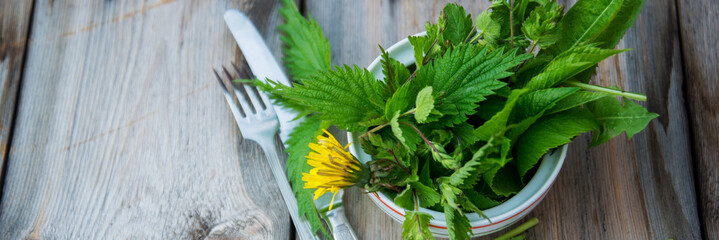 Close up salad leaves garden herbs and edible flowers. Healthy nutrition. Food background