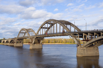 Naklejka premium Automobile bridge across the Volga river in the September day. Rybinsk, Russia