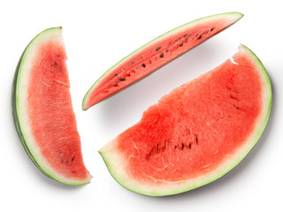 Slices of a large watermelon on a white background. View from above