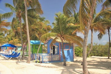 Colorful cabanas and lounge chairs along the beach at Princess Cays in the Bahamas