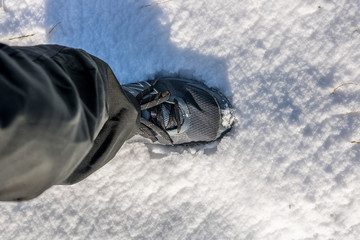 Foot step in to new snow during morning track in nature