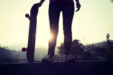 Skateboarder skateboarding at skatepark