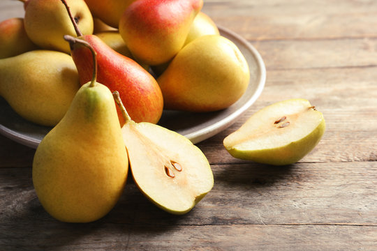 Ripe pears on wooden table. Healthy snack