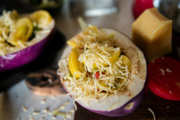 Autumn food with fresh vegetables, quick lunch: eggplant stuffed with tomatoes and cheese. The concept of healthy and vegetarian food.