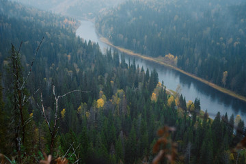 Misty landscape with soft: top view of the river in the autumn forest