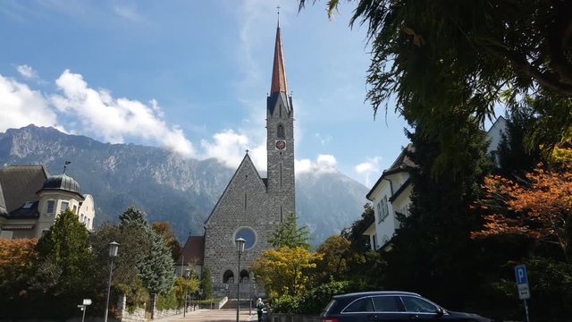 Church in the streets of Schaan in Liechtenstein. Moving from right to left on a sunny day.