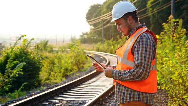An engineer on a railway explores and records the state of the tracks