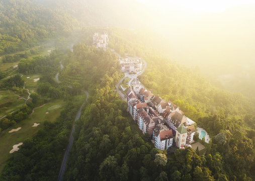 Aerial view of french style building at Bukit Tinggi with dramatic fog and sunrise.
