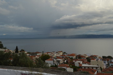 Mountain Village at the edge of Sea with Clouds