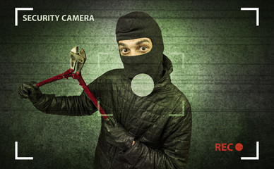 Caught burglar by house camera in action.