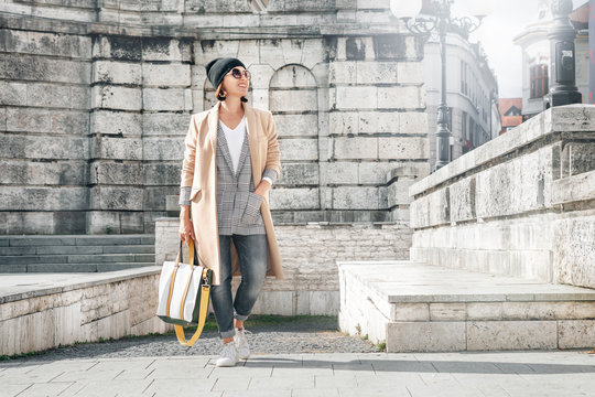 Woman In Trend Autumn Multilayered Outfit Walks On City Old Street