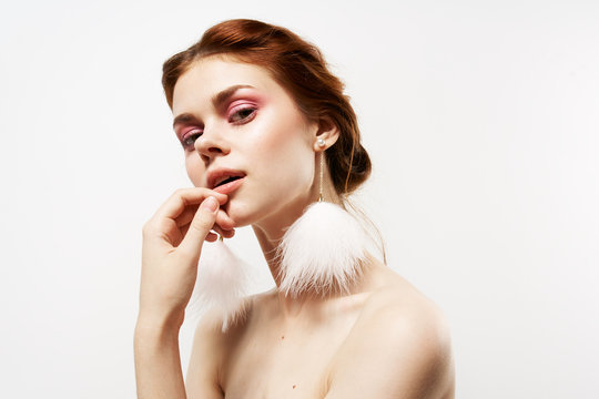 woman in earrings with makeup portrait