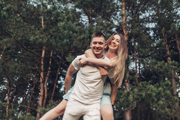 Beautiful Young Couple Have Fun at Sunset Outside of City