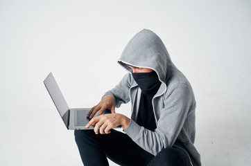hacker man hacks laptop