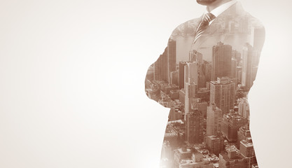 Businessman in suit standing thinking with metropolis graphic 