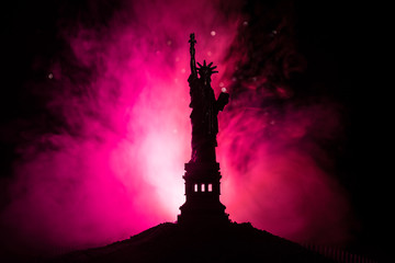 Silhouette statue of liberty on dark toned foggy background. Statue of Liberty on the background of...