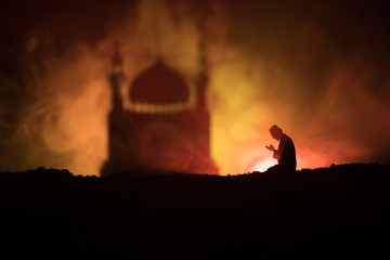 Silhouette of mosque building on toned foggy background. Ramadan Kareem background. Mosque at...