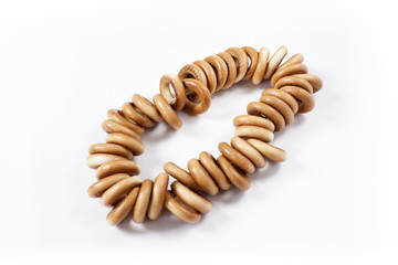 Obraz premium Bagels on rope, isolated on white background