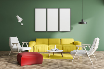 Green living room with poster gallery, sofa