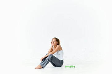 Fototapeta na wymiar woman sitting on the floor thinking on an isolated background