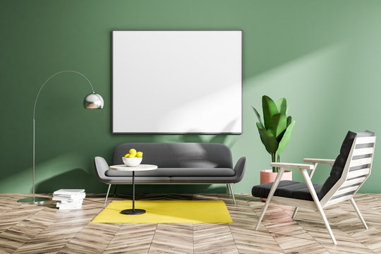 Green living room with sofa and poster