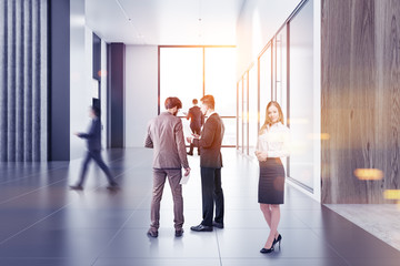 Business people in modern office lobby