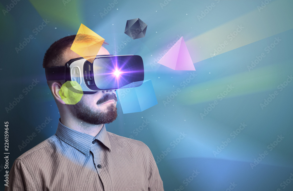 Poster amazed businessman with virtual reality colorful geometric shapes in front of him
