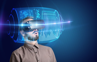 Amazed businessman with high tech 3D projection in front of him 