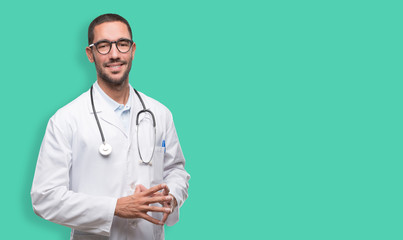 Confident young doctor posing