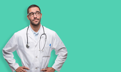 Doubtful young doctor posing