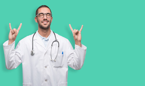 Happy Young Doctor With A Gesture Of Rock