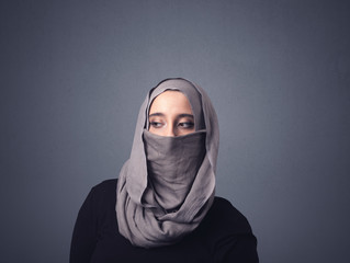 Naklejka premium Young muslim woman wearing niqab 