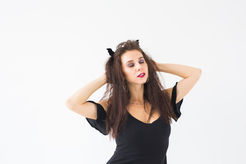 Smiling brunette woman in halloween makeup posing