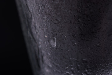 Drops of water on a glass on a black background