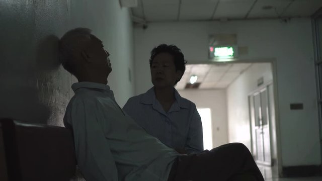 Asian senior parents couple waiting for news from surgery doctor sad, stress and worry 4k