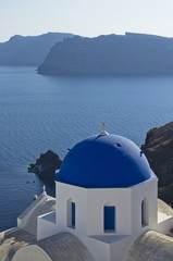 Fototapeta na wymiar Blue temple's dome in Santorini, Greece