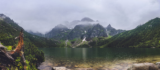 Naklejka na ściany i meble View on Tatra mountains from Morskie Oko, Poland, heavy fog