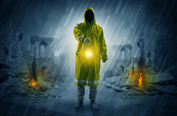 Destroyed place after a catastrophe with man in raincoat and lantern concept
