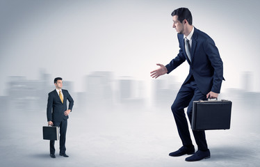 Giant businessman being afraid of small serious executor with suitcase
