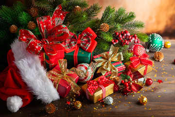 Christmas balls and gift boxes on wooden background